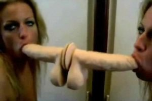 Cock craving blonde sucking a monster dildo