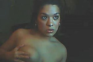 Hispanic bitch playing with her huge tits