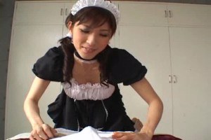 Japanese brunette sucks on hard cock