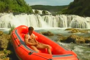 A muscular guy masturbating outdoors