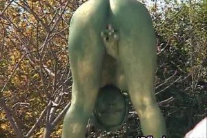Hot asian babe posing as a statue and showing off her tits and ass