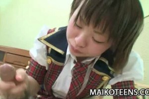 Sexy young oriental beauty handling cock