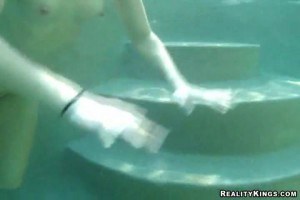 Delicious redhead blows a dude's dick underwater for some money