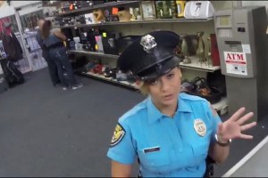 Sexy female cop stripping in Pawn shop