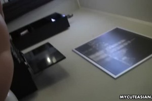 Beautiful Japanese teen rubs her shaved pussy and films the whole scene