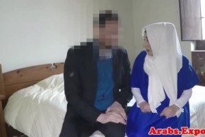 Hijab muslim taken from behind before blowing snake