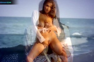 Big tits brunette Sensual Jane fingering at the beach