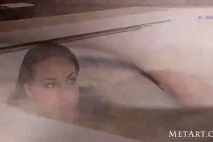 Attractive mature whore cooling off at the tub