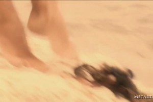 A skinny blonde beauty on sand