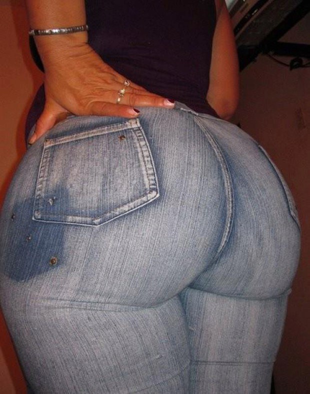 Round ass babe teases in denim pants