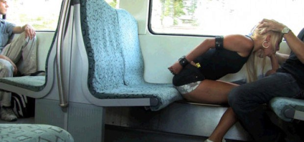 Cuffed blonde sucks cock on the train