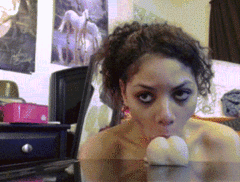 Curly haired amateur sucks on her big dildo