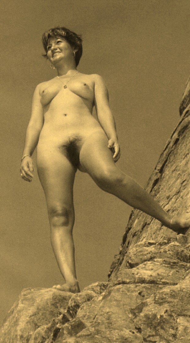50's MILF is naked on the rocks