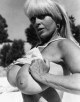 Blonde cougar from 60's shows her melons 
