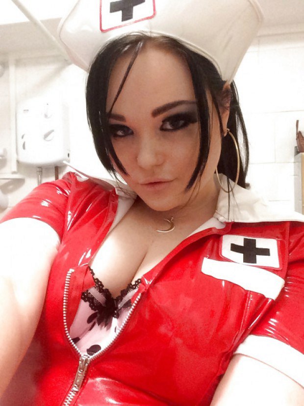 Hot brunette nurse has a sexy cleavage