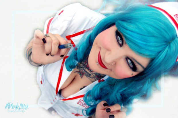 Alternative nurse with blue hair teases with that cleavage