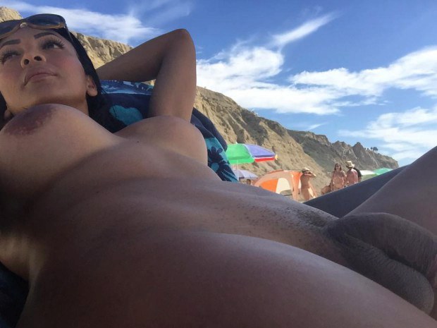 Brunette ladyboy catching some sun outdoors