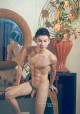 Muscular Asian gay stud poses in the hotel room