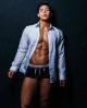 Male model looks perfect in a shirt and underwear