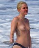 Sexy blonde Miley Cyrus is topless and naughty 