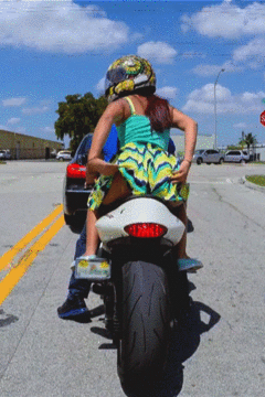 Amateur MILF shows her ass on a motorcycle