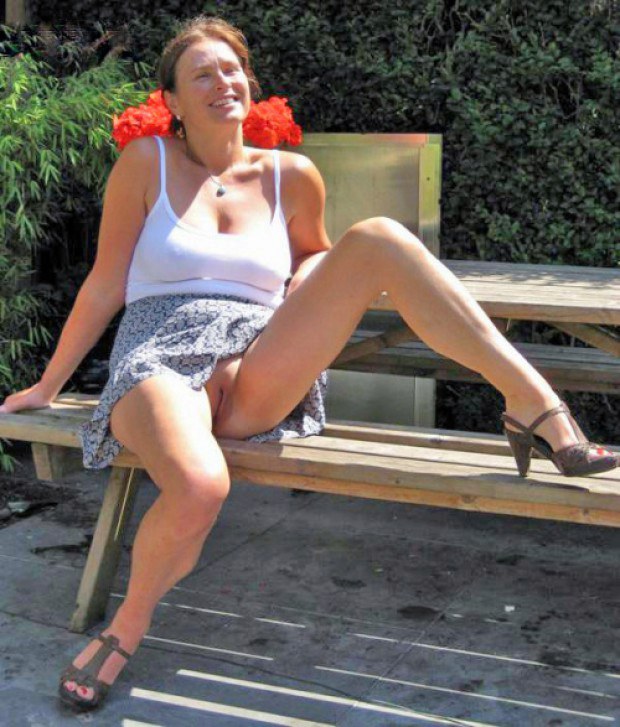 Mature in high heels shows her snatch outdoors