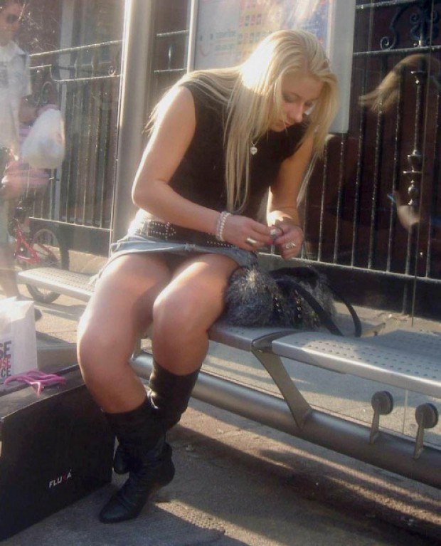 Blonde skank shows upskirt on the bench
