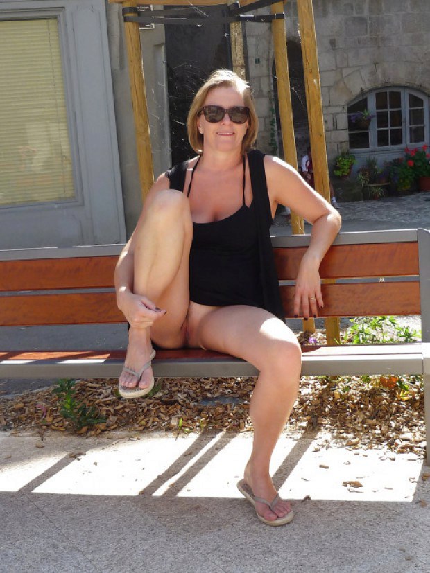 Wife with sunglasses shows her snatch on the public bench