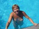 Blonde mature is naked in the pool