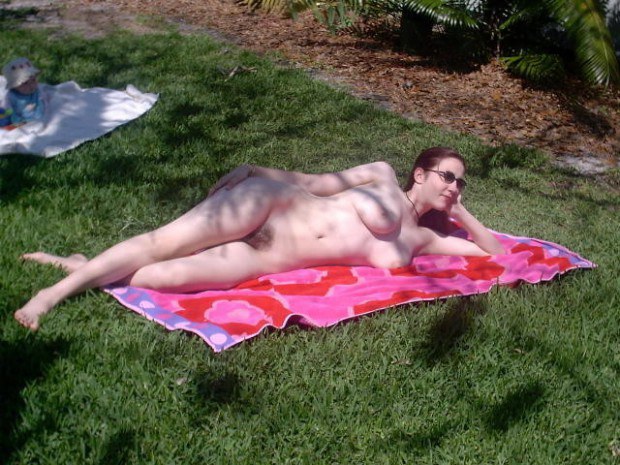 Amateur nudist catches some sun in the park