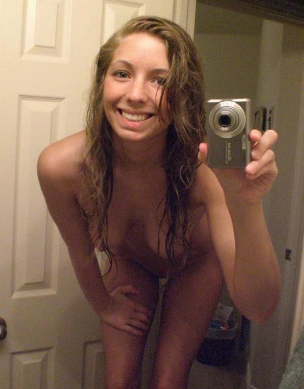 Aroused teen amateur takes a selfie with the camera